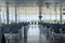 Modern airport waiting hall interior with empty chairs.