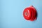 Modern alarm bell on color background