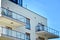 Modern apartment buildings on a sunny day with a blue sky. Facade of a modern apartment building