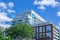 Modern apartment complex in the city tree blue sky clouds