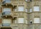 Modern apartment complex in vintage style, balconies with closed roller shutters, Beautiful belgian architecture