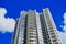 Modern Apartment Tower With Blue Sky and White Clouds, Sydney, Australia