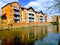 Modern apartments by the canal, riverside living