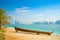 Modern Arabian City of Abu Dhabi. Landscape and cityscape panorama with wooden boat in the forground on the beach. UAE