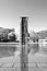 Modern architecture fountain, in infrared black and white, surrounded by water, in downtown Berlin