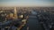 Modern architecture of London downtown by sunset in beautiful aerial drone panorama over River Thames, UK