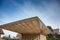 Modern architecture, Zug, Switzerland.  Angular roofline of the Stadtgarten Pavillon with clear blue sky background