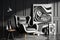 modern armchair in black and white, surrounded by abstract art