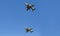 Modern armed military fighter jets flys in formation through the sky