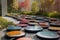 modern art installation with stepping stones, metal sculptures, and vibrant colors