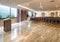 Modern auditorium interior with lecturer desk and rows of vintage chairs in luxury training center. Educational class background