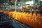 A modern, automated factory assembly line, showcasing the precise process of bottling fresh orange juice