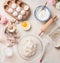 Modern baking background with flour in bowl, eggs and ingredients on white kitchen table background, top view. Home Bake. Recipes