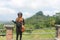 Modern balinese girl holding Canang Sari- offering for ghosts an