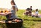 Modern barbecue grill with kebab and blurred family on background