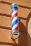 Modern barber shop pole on the wall