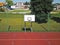 Modern basketball court in the courtyard of primary school. Multifunctional children`s playground with artificial surfaced fenced