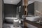 The modern bathroom features a mirror, basin, and bathtub, creating a stylish interior for today\\\'s lifestyle
