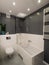 Modern bathroom. Grey walls and white tiles