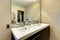 Modern bathroom large double white sink with mirror.