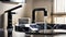 Modern bathroom with metal faucet and black sink. Modern interior of a bathroom or kitchen