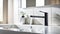 Modern bathroom with metal faucet and white sink. Modern interior of a bathroom or kitchen