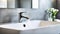 Modern bathroom with metal faucet and white sink. Modern interior of a bathroom or kitchen