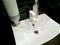 Modern bathroom sink and faucet in public toilet and restroom. White tap. Virus protection concept. Sanitary rules and requirement