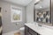 Modern bathroom with a sleek sink and a large mirror.