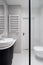 Modern bathroom with terrazzo tiles and reinforced glass