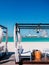 Modern Beach Gazebo white curtain with white seat blue sea clear summer sky in Abu Dhabi