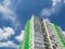 Modern beautiful new buildings. Colored wall on the background of blue sky. Modern construction, new neighborhood. Copy space