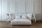Modern bedroom design interior, white satin bed, white wall, dark wood floor