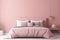 Modern bedrroom with monochrome neutral blush pink empty wall. Contemporary interior design with trendy wall color, bed, pillows