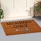 Modern beige Welcome members only zute doormat with key outside home with yellow flowers and leaves