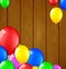 Modern birthday balloons on wooden background