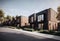 Modern black and brown house with a lot of windows and balconies.