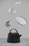 Modern black cast iron teapot with levitation cups, artistic background set, art set for tea time. 3d rendering