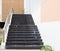 Modern black stairs and metal handrail