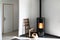 Modern black stove with burning flames and pellet bag in a living room