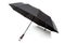 Modern black umbrella in the unfolded form.