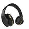 Modern black wireless headphones with golden details