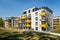 Modern block of flats with yellow balconies