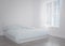 Modern blue bed in the light room near the empty wall. mockup. 3d render