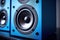 Modern blue powerful audio speaker on yellow background, space for text