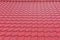 Modern bright deep red glossy rooftop tiling texture background