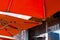 Modern bright orange awning with stainless steel tube