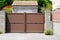 Modern brown high design gate aluminum portal outdoor door front of suburb house