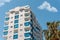 Modern building corner and windows. Multi-storey new multi-colored residential building