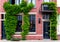 Modern building covered with green ivy